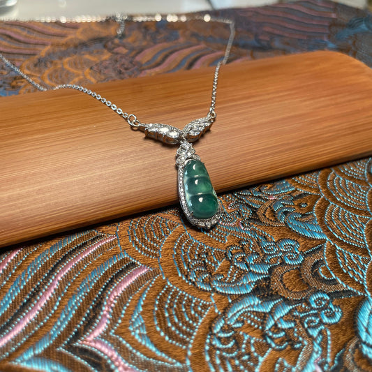 Emerald bean pendant